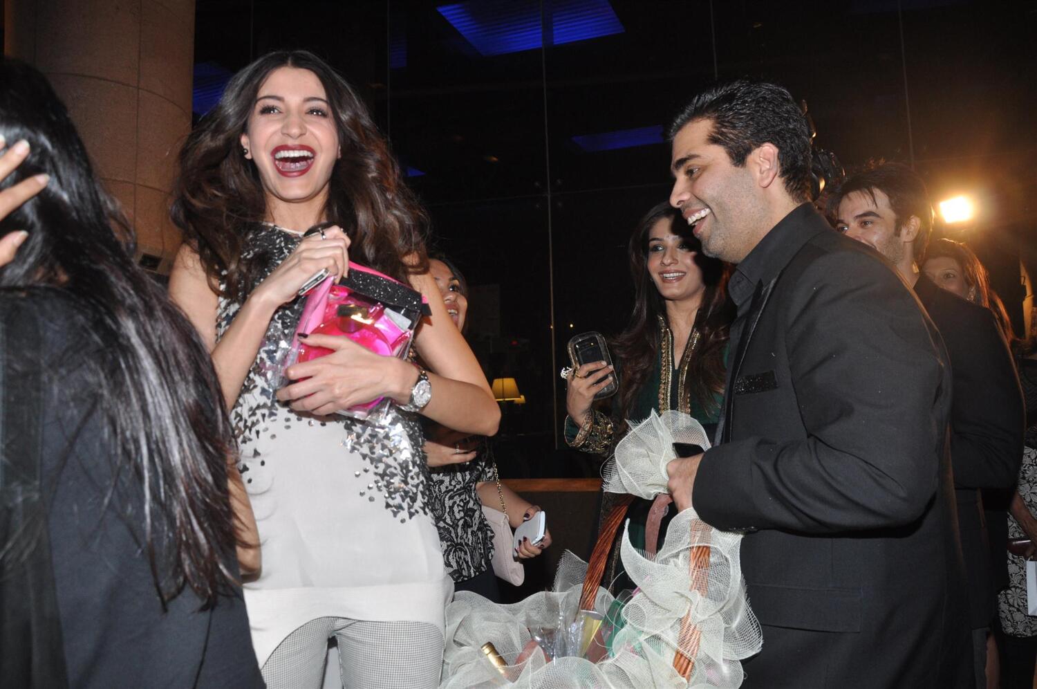 Anushka Sharma and Karan Johar having fun with the gift hamper at the